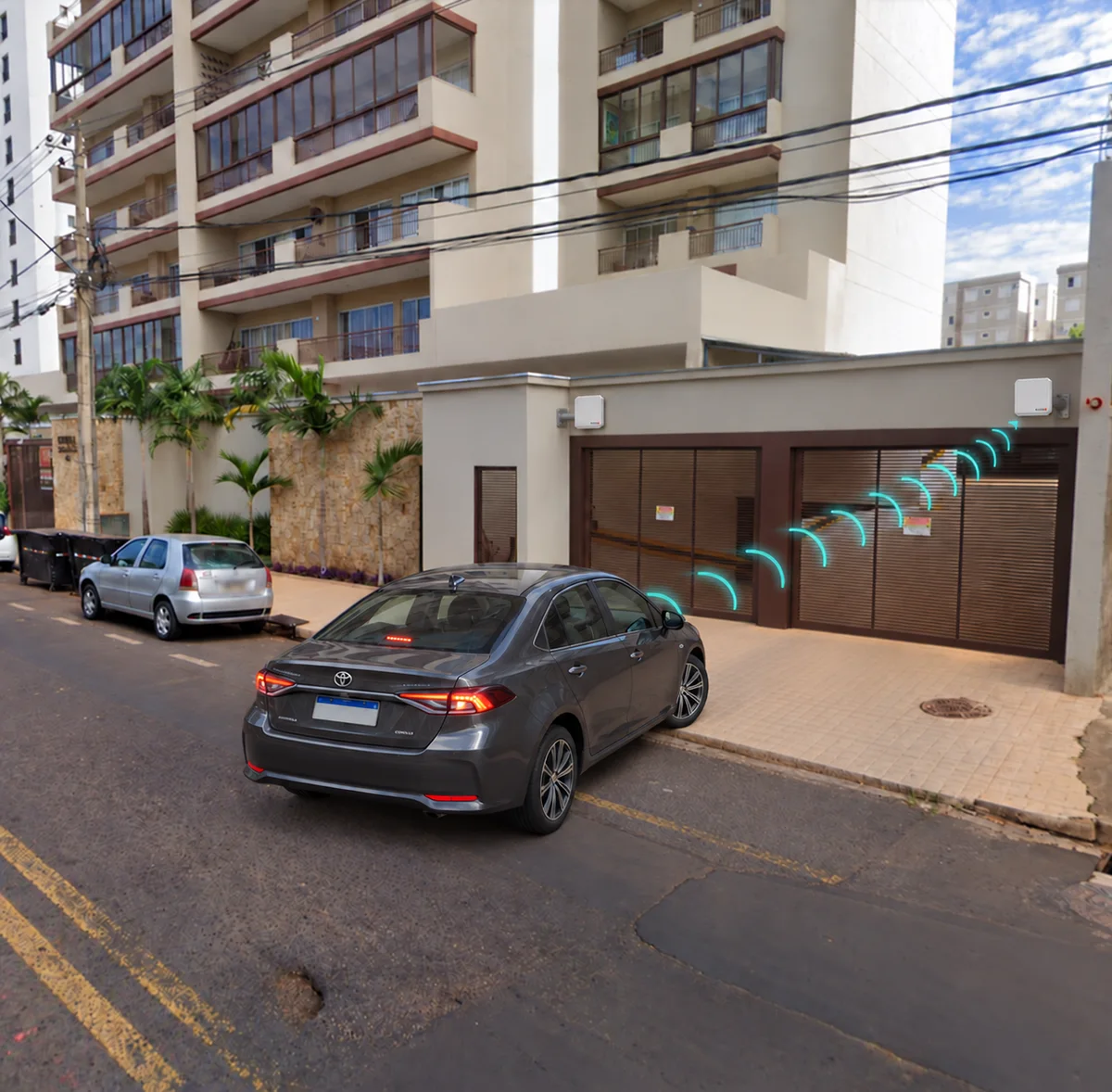 Carro parado diante do portão da garagem de um prédio, com sinais de leitura sem fio da tag veicular